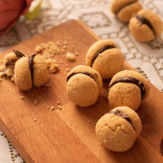 Baci di dama al cioccolato alla nocciola